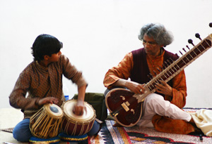 Pandit Shivnath Mishra and a student